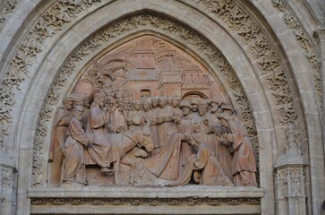 Christ's Entry into Jerusalem by Lope Marin in 1548 on the Gothic Puerta de Campanilla entrance door of the Cathedral of Seville, Spain