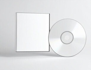 White CD disc next to a clear plastic CD jewel case on a light grey background blank