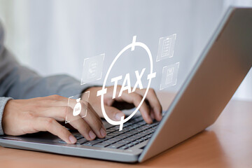 Tax return calculation concept financial research government tax businessman using laptop filling out income tax form online for payment