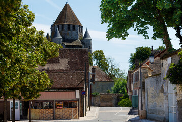 Charming French town with stone buildings and greenery