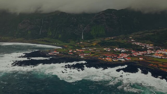 Aerial View of a Coastal Vllage with Waterfalls on Lsh Volcanic Cliffs