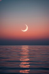 Beautiful Crescent Moon Reflecting on Calm Ocean Water at Twilight