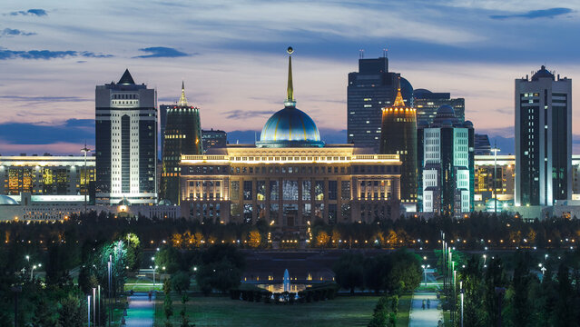 Close up view of Astana city day to night timelapse and the president's residence Akorda with park