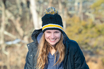 Young Woman with Big Smile Outdoors with Beanie Hat