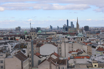 European city skyline with historic rooftops and modern towers