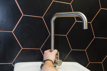 Plumber changes broken, leaking plumbing fixtures in the kitchen. Repair of a water tap. Plumber...