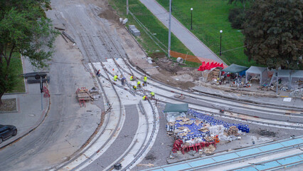 Repair works on the street timelapse. Laying of new tram rails on a city street