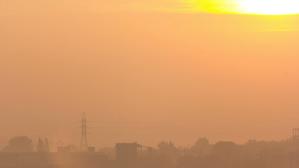 Obraz premium Sunrise at city with high-voltage power transmission line timelapse