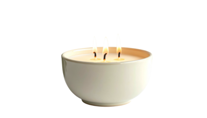 A lit candle in a white bowl with three flames, set against a stark black background