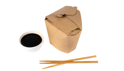 Brown take-out container with food, small white dish of soy sauce, and wooden chopsticks