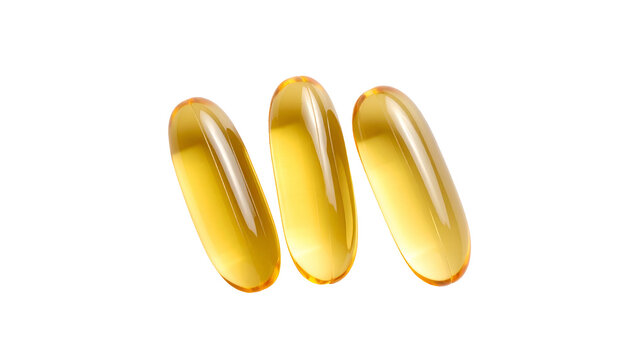 Three translucent golden oval supplements, brightly lit against a stark black background