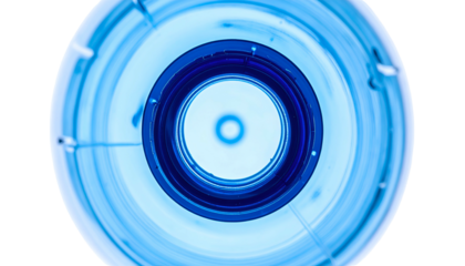 Overhead, macro perspective inside a clear plastic bottle. Focused on its blue neck
