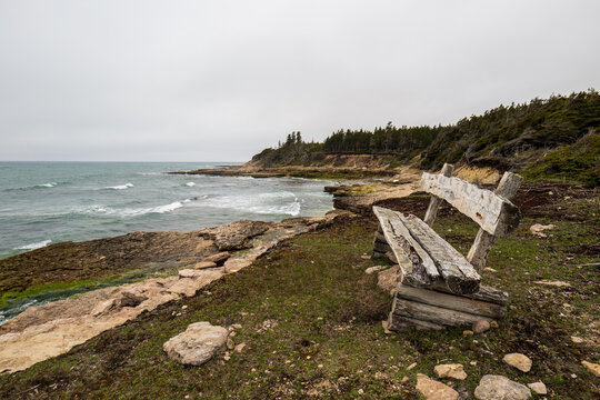 Rocky Shoreline meets Endless Blue at &ldquo;Chicotte&rdquo; (Whip) on Anticosti Island, where Dense Forest Borders the Sea, creating a Wild, Remote and Breathtaking Coastal View