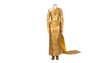 Elaborate golden Thai traditional dress on a mannequin against black background