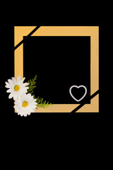 Daisy flower in loving memory background border on black with gold frame, white love heart and symbol of death ribbon. Floral memorial design for funeral card.