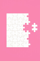 Jigsaw puzzle with missing piece on pink background. Business opportunities for communication, partnership, problem solving, teamwork concept.