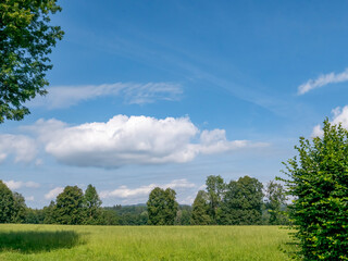 Beautiful pre-Alpine landscape with blue skies in the district of Miesbach in Bavaria.