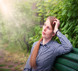 Young pretty girl on the bench