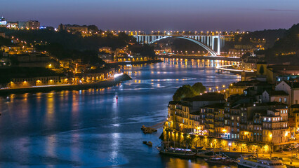 Day to night view of the historic city of Porto, Portugal timelapse from the Dom Luiz bridge