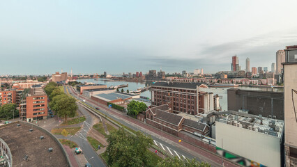 Aerial panoramic view over towers in Maashaven night to day timelapse in Rotterdam