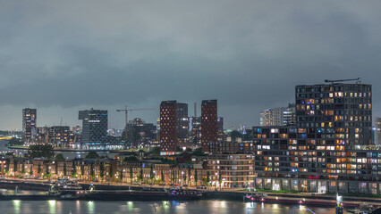 Panoramic aerial day to night timelapse of Katendrecht peninsula and Maashaven harbour in Rotterdam, The Netherlands.