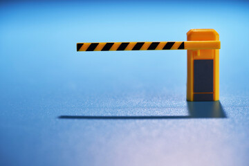 parking  exit barrier against blue background