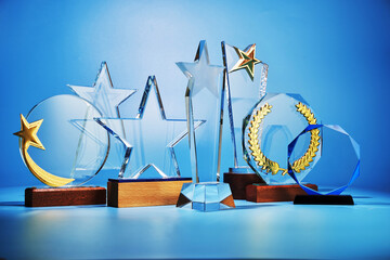 group of crystal trophy against blue background
