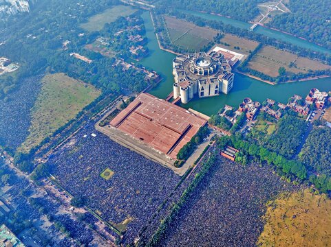 Dhaka, Bangladesh - 31 December 2025: Aerial view of the impressive Jatiya Sangsad Bhaban complex and surrounding water features amidst a sprawling urban landscape.