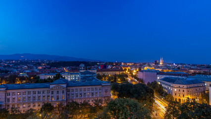 Panorama of the city center day to night timelapse with intersection in front of national theater and museum in Zagreb, Croatia.