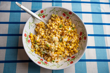 Delicious summer side dish of creamy corn kernels and fresh herbs