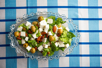 Top view of nutritious vegetarian salad on a vintage glass platter