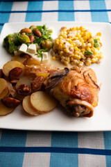 Complete Mediterranean Meal Featuring Baked Chicken, Sliced Red Onions, and Nutty Salad