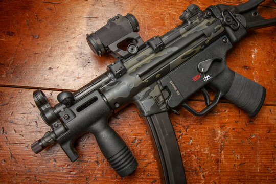 Heckler & Koch SP5K, 9mm submachine gun. Limited edition Cerakote paint, Aimpoint T-2 Micro Red dot sight with camouflage cordura wrap, Scalarworks 1.42" riser on MFI ultra low profile rail.