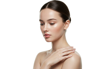 Young caucasian woman with sleek dark brunette hair in a low bun, glowing porcelain skin, nude-pink glossy lips, hand on shoulder, soft diffused lighting against a transparent studio background,