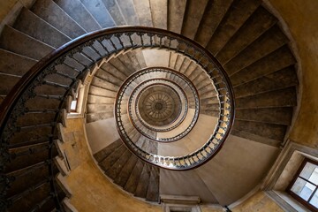 Generative AI rendering of a spiraling vintage staircase seen from above showcasing intricate