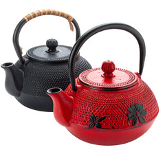 Two cast-iron teapots, one red, one black, with decorative patterns and sturdy handles