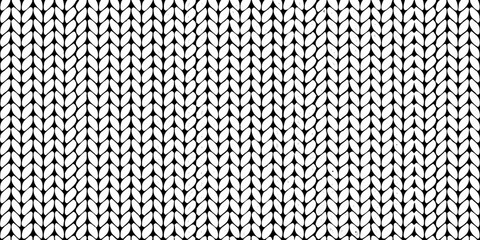 Detailed black and white knit texture displaying a repeating vertical rib pattern © Ratan