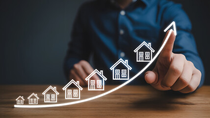 Hand traces upward arrow over growing row of houses, illustrating real estate market growth and investment.png