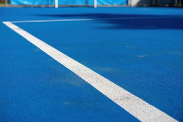 Close up of a blue tennis court with white boundary lines white lines sports recreation