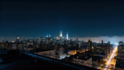 Panoramic nighttime view of illuminated skyscrapers forming a massive metropolitan cityscape under a dark blue sky.