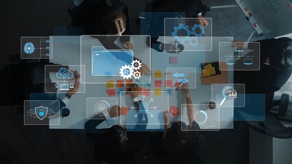 A top-down view of a business team collaborating in a meeting, utilizing digital technology for data analysis, strategy planning, and enhancing project performance in a modern workspace. Raster