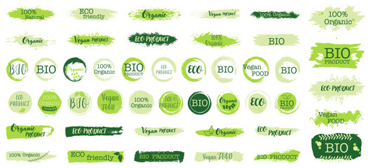 Eco organic labels set with green brush textures. Natural product badges for bio vegan and ecology