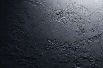 Textured Stone Backdrop: A close-up view reveals a rugged, textured stone surface, its rough, dark gray tones subtly highlighted by soft, directional light, creating a sense of depth and timelessness.