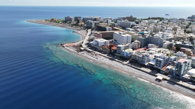 Aerial drone cinematic video of famous main sandy beaches of Rhodes island west coast called Akti Miaouli and Akti Kanari famous for luxury hotels and nice seaside restaurants, Dodecanese, Greece