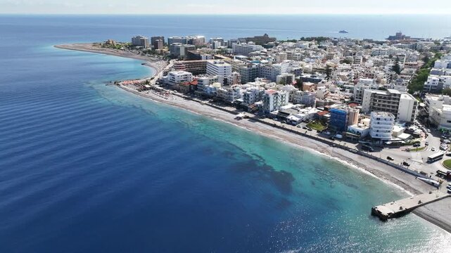 Aerial drone cinematic video of famous main sandy beaches of Rhodes island west coast called Akti Miaouli and Akti Kanari famous for luxury hotels and nice seaside restaurants, Dodecanese, Greece