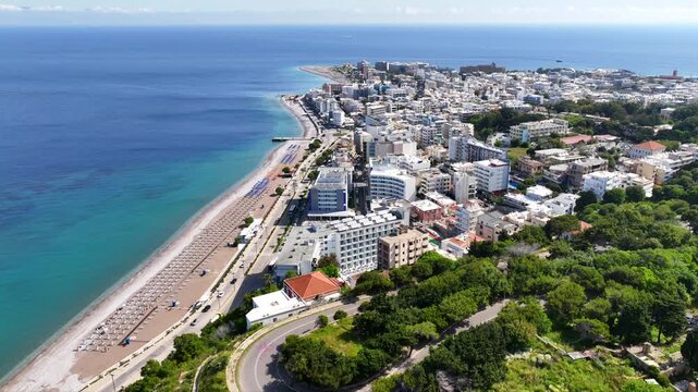 Aerial drone cinematic video of famous main sandy beaches of Rhodes island west coast called Akti Miaouli and Akti Kanari famous for luxury hotels and nice seaside restaurants, Dodecanese, Greece