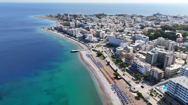 Aerial drone cinematic video of famous main sandy beaches of Rhodes island west coast called Akti Miaouli and Akti Kanari famous for luxury hotels and nice seaside restaurants, Dodecanese, Greece