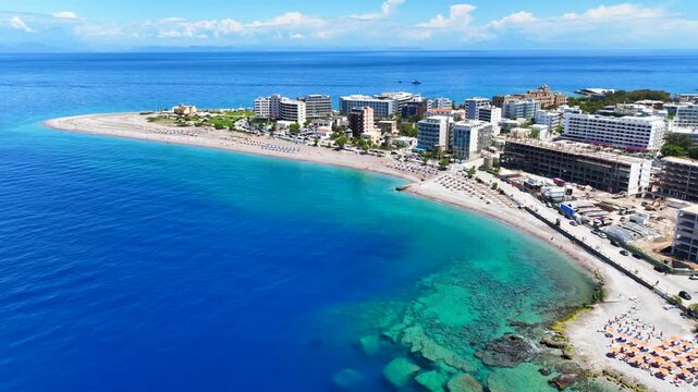 Aerial drone cinematic video of famous main sandy beaches of Rhodes island west coast called Akti Miaouli and Akti Kanari famous for luxury hotels and nice seaside restaurants, Dodecanese, Greece