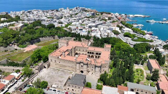 Aerial drone cinematic video of iconic Palace of the Grand Master in old fortified town of Rhodes island an Unesco World Heritage site, Dodecanese, Greece