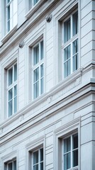 Fototapeta premium The elegant façade of the building, with its tall windows and classic ornamentation, will enhance the urban backdrop for architectural portfolios or tourist guides.